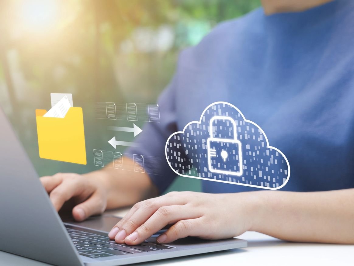 Person reviewing encrypted files on a laptop